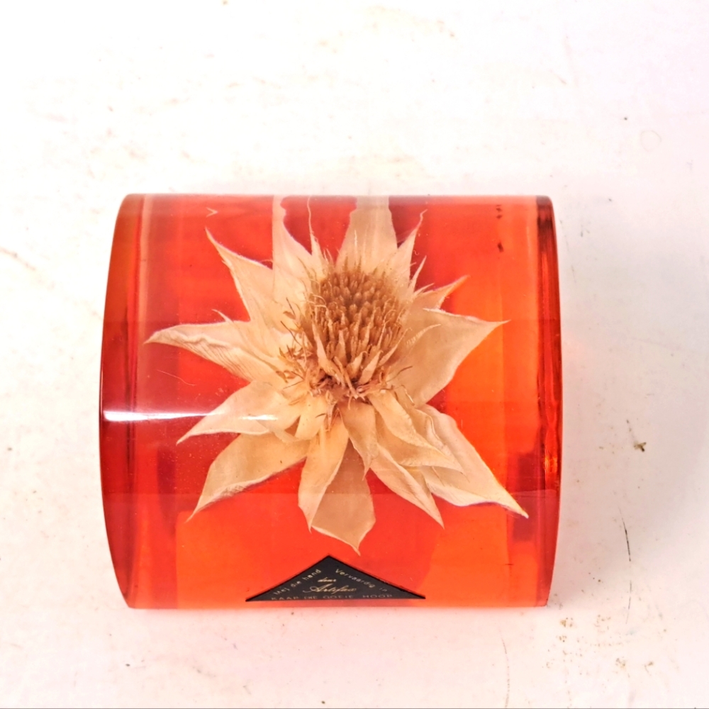 Lucite Paper Weight With Flower Blossom And Red Lucite Bottom